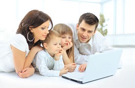 family-looking-into-the-laptop-enthusiastically-stock-photograph_csp32453994 (2)